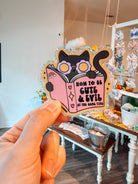 How To Be Cute & Evil At the Same Time Cat Sticker - Modern Companion